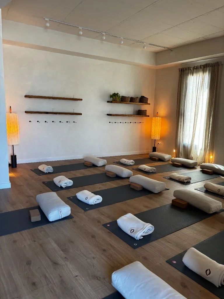 Yoga studio with windows, shelves and natural light